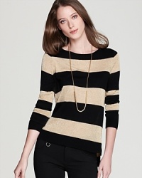 Bold stripes lend structure to a slouchy VINCE CAMUTO sweater, finished with a splash of sparkle for a lustrous everyday look.