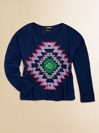 A brilliant tribal print adds a splash of color and coolness to a long-sleeved tee.ScoopneckLong sleevesPullover styleRayonHand washImported