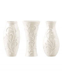 Spread elegance throughout your home with Opal Innocence Carved vases, featuring classic silhouettes with an embossed vine motif in shiny white porcelain. A pretty showcase for a couple of blooms.