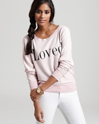 This slouchy-cool WILDFOX sweatshirt shows its adoration for you with the word Loved.