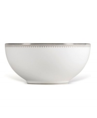 Like the grosgrain ribbons that dangle from her famous dresses, this white bone china collection of dinnerware and dishes from Vera Wang features two different platinum grosgrain borders. The wide corded border of textured grosgrain evokes soft elegance while the narrow wisp of platinum edging adds chic style. Serving bowl shown left.