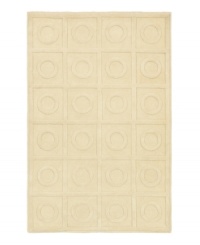 A clean, quiet design of geometric shapes presents a perfectly symmetrical pattern on this ivory-beige rug. Hand-tufted in India, this alluring piece features a raised surface feel that is soft to the touch and durable enough for the most active indoor environments.