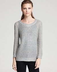 A sprinkling of sequins decorate this Aqua sweater for fall shimmer, upgrading your wardrobe with day-to-night chic.