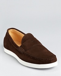 Penny loafers rendered in quality suede and updated with modern, sporty details for a wear-anywhere casual shoe.