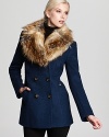 A bold faux fur collar brings cozy winter style to this double-breasted wool coat from Laundry by Shelli Segal.