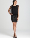 Aidan Mattox uses sequins and lace as brilliant accents on this timeless little black dress.