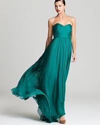 Badgley Mischka's strapless sweetheart gown makes a brilliant presentation in a classic silhouette and vibrant hue.