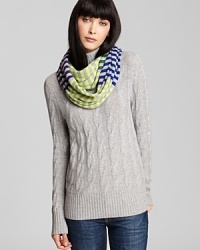 Multi-colored stripes and an easy silhouette make Aqua's loop scarf a must-have accessory this season.