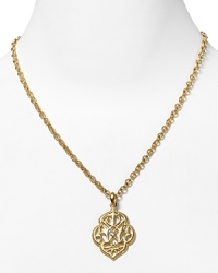 With an ornate pendant, T Tahari's gold-tone necklace is sure to define your neckline. Highlight the statement design with classic pieces to ensure the focus remains on this glamorous adornment.