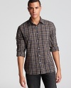 A handsome plaid shirt sets the tone for your everyday look, cut in a slim fit for modern appeal.