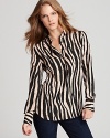 Executive style goes exotic as a statement zebra print shakes up the essential Isaac Mizrahi Jeans blouse. Effortlessly-chic dressed down with denim and impeccably polished with a crisp pencil skirt.