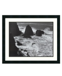 You can almost hear the sound of the waves crashing against the rocks in this timeless print from renowned photographer Ansel Adams. In elegant black and white with a matte black frame, the striking image evokes a sense of beauty and eternity in any space.