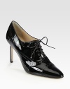 Critically acclaimed patent leather oxford, rejuvenated by a signature point toe and skinny heel. Stacked heel, 3½ (90mm)Patent leather upperLeather lining and solePadded insoleMade in ItalyOUR FIT MODEL RECOMMENDS ordering one size up as this style runs small. 