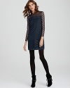 Feminine but not girly, this DIANE von FURSTENBERG dress puts a modern spin on retro polka dots, adding a drop waist with crochet detail and chic sheer sleeves. Edge up the look with opaque tights and spiky lace-up booties.