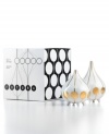 Jonathan Adler offers a taste of the future with undeniably cool salt and pepper shakers. Footed teardrop shapes are a blast in white porcelain with goldtone stripes and spots.