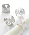 Barrel-shaped napkin rings cut with pretty snowflakes and featuring a silver Florentine finish give your table the look of a shimmering winter wonderland.