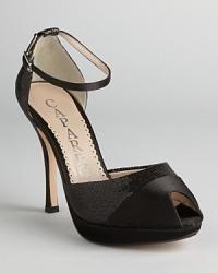 Basic but hardly boring, these Caparros peep toe platform sandals subtly combine satin and glittery lame.