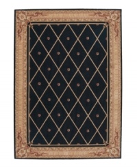 Every work of art deserves a frame. The Ashton House rug collection sets new standards of richness with their opulent colors, European-inspired decorative motifs, and luxuriously textured wool pile. An elaborately detailed frame displays a classic design of diamond shapes with center studs, in brown over a striking black background. The result is as ornate and rich as it is simple.