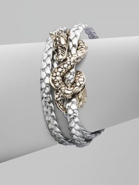 From the Naga Collection. A braid of rich leather wraps the wrist three times while weaving in and out of a curvaceous silver dragon.LeatherSterling silverLength, about 6½Lobster claspMade in Bali