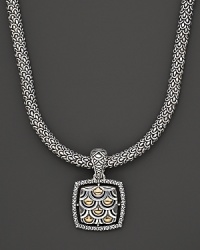 From the Naga collection, a gold and silver woven chain necklace with square Naga pendant, designed by John Hardy.