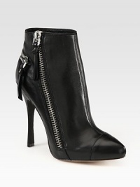 Street-ready zippers amplify this leather ankle boot with a hidden platform and soaring heel. Self-covered heel, 5 (125mm)Hidden platform, ¾ (20mm)Compares to a 4¼ heel (110mm)Leather upperAsymmetrical zip closure and decorative back zipLeather lining and solePadded insoleImportedOUR FIT MODEL RECOMMENDS ordering one half size up as this style runs small. 