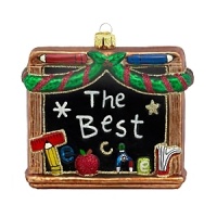 A whimsical holiday ornament of a school chalkboard, inscribed with The Best Teacher.