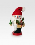 White-clad Father Christmas nutcracker is entirely hand-crafted in Germany, wearing a red knit hat and carrying a velvet stocking filled with gifts.6½ X 6 X 11HCarved woodMade in Germany