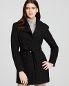 This classic yet modern Calvin Klein coat is a great wardrobe staple. The traditional mid-length and optional belt are just the type of details you'll adore season after season.