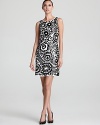 Aidan Mattox's 70's inspired shift lends a bold look in black and white--shiny sequins take on a floral form.