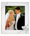 Preserve a cherished moment of your own or treat your favorite newlyweds to the True Love picture frame. Interlocking hearts adorn elegant silver plate, a beautiful showcase for wedding or honeymoon photos.