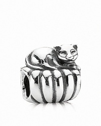 A sterling silver cat curls up on a cozy cushion. Charm by PANDORA.