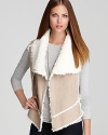 This luxe-looking vest, made from a smooth faux shearling, signals the season of dressing in cozy-soft layers is near.