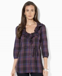 A bold plaid pattern sweeps across Lauren Jeans Co.'s chic cotton tunic, crafted with feminine ruffles at the neckline and three-quarter-length sleeves. (Clearance)