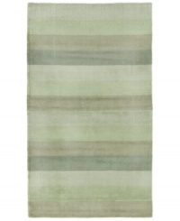 Hand-tufted, blended wool gives an exceptionally soft feel to this rug from the Coastal Treasures collection. In a shimmering, striped design of moss-green colorways, this sophisticated piece adds serene character to every decor.