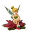 Jim Shore brings his unique folk art-inspired creativity to a beloved Disney character. Tinkerbell on Holly Leaf figurine will be a treasured gift for children and collectors alike.