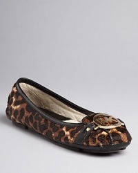 Cheetah wins in these wildly exciting MICHAEL Michael Kors moccasin flats, with bold logo accents that pop.