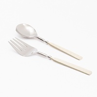 Bring the beauty of the beach to your table with the Simply Designz Ivory Collection. Handcrafted with delicate ivory handles, this serving set is an elegant way to serve salad or fruit.