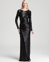 A cowl back lends chic intrigue to Badgley Mischka's long sleeve, sequined gown.