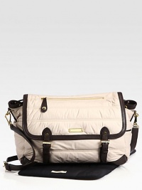 An ultra-versatile, ultra-functional messenger-style diaper bag featuring adjustable shoulder strap, plenty of pockets and matching changing pad.Adjustable shoulder strapMagnetic flap closureInside drawstring closureOutside zipper pocketInside open pocketsMatching changing padAbout 14W X 11H X 5DFully linedPolyesterImported