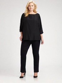 A luxurious style made from matte silk and featuring elegant embellishments. Pair this relaxed-fit blouse with slim-fitting pants or skinny jeans.Round neckCold shouldersEmbellishments along three-quarter sleevesPull-on styleSide slitsAbout 24 from shoulder to hemSilkDry cleanImported