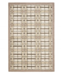 A traditional basketweave plaid is updated for the modern home in this area rug only from Martha Stewart rugs. Hand tufted in India of long wool fibers, this luxurious home accent presents unparalleled comfort and style underfoot.