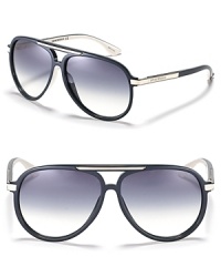 Retro-inspired aviator sunglasses with metal trim along bridge and temples.