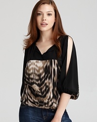 An animal print of rich silk lends exotic chic to this Akiko top, accented with slit sleeves.