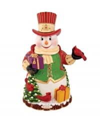 Wearing a gold-trimmed vest and top hat, the Regal Snowman cookie jar from Christopher Radko shines with incredible detail. Christmas-red cardinals, winter foliage and gifts galore will make him a favorite part of any holiday home.