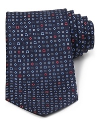 Gancini logos, diamonds and rings alternate in an alluring graphic pattern on this refined tie, rendered in soft Italian silk for a plush hand. Wear it to work and add extra polish to your day.