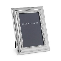 Handsome photo frame designed with elegant sweeping lines -- a beautiful display for a treasured image.