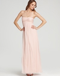 Master streamlined elegance in this Amsale strapless gown, flaunting a famously flattering empire waist.