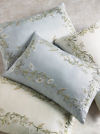 Dainty, hand-embroidered meadow flowers adorn this lovely pillow's framework in the palest potpourri of tints. 14 X 22Silk sateen with feather/down fillDry cleanImported