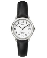 Complete your look with simple style. This Timex watch features a black smooth leather strap and silvertone mixed metal round case. White dial with black numerals, logo and date window. Analog movement. Water resistant to 30 meters. One-year limited warranty.