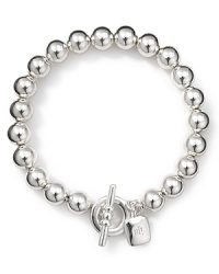 Take your jewel box in a classic direction with Lauren Ralph Lauren's toggle bracelet. In sterling silver plate, this strand is an essential asset to every wardrobe.